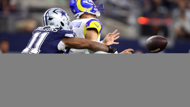 Dallas Cowboys linebacker Micah Parsons (11) attempts to sack Los Angeles Rams quarterback Matthew Stafford (9) in the second quarter at AT&T Stadium.